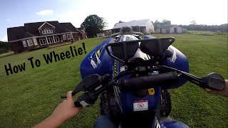 How to Wheelie a Automatic Four Wheeler [upl. by Car932]