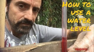 How to use a water level  the diy basics [upl. by Munford]