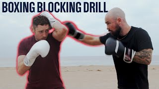 How To Block A Punch  Defensive Blocking Drill [upl. by Aiynat319]